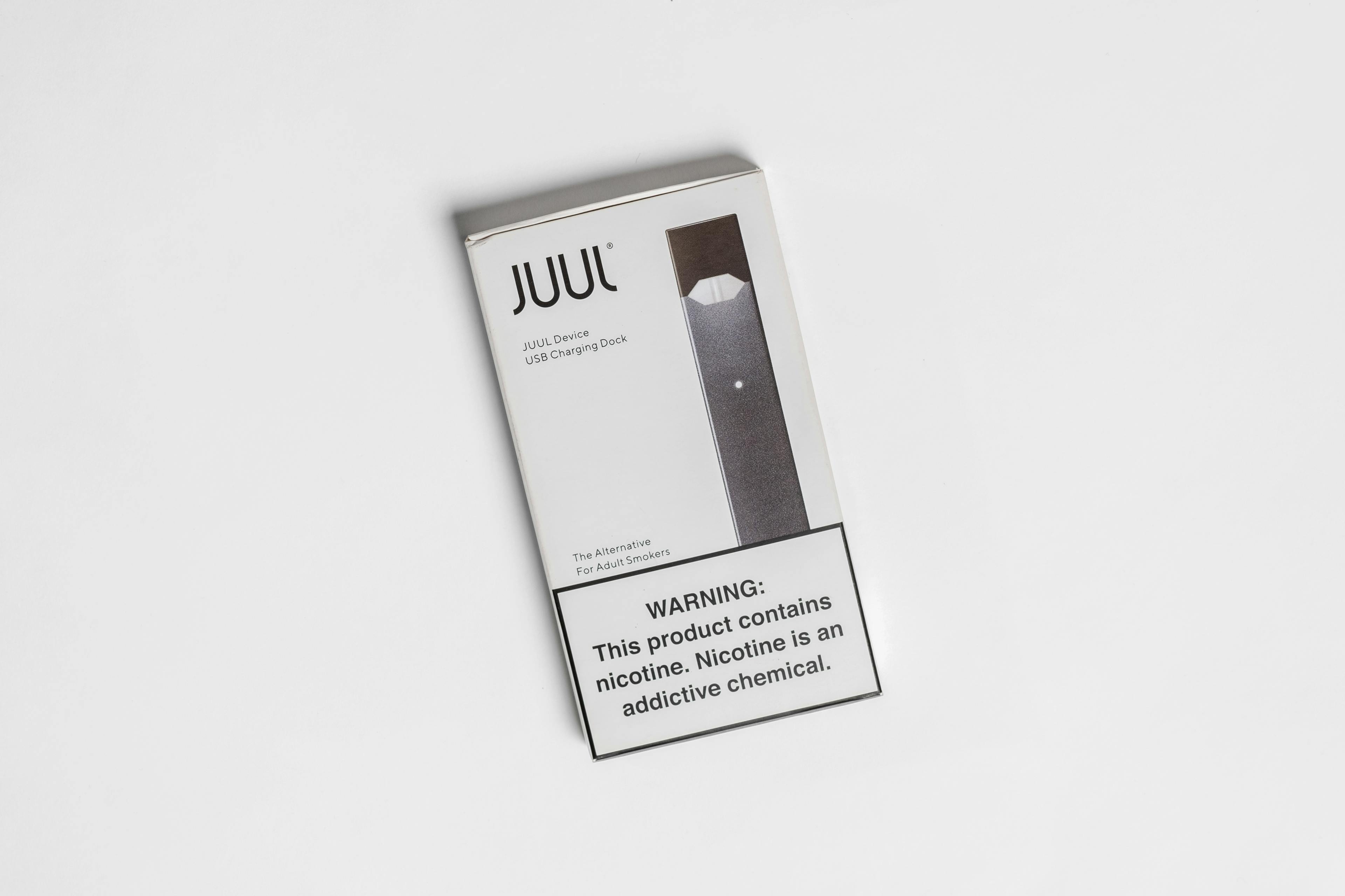 A photograph of a JUUL e-cigarette