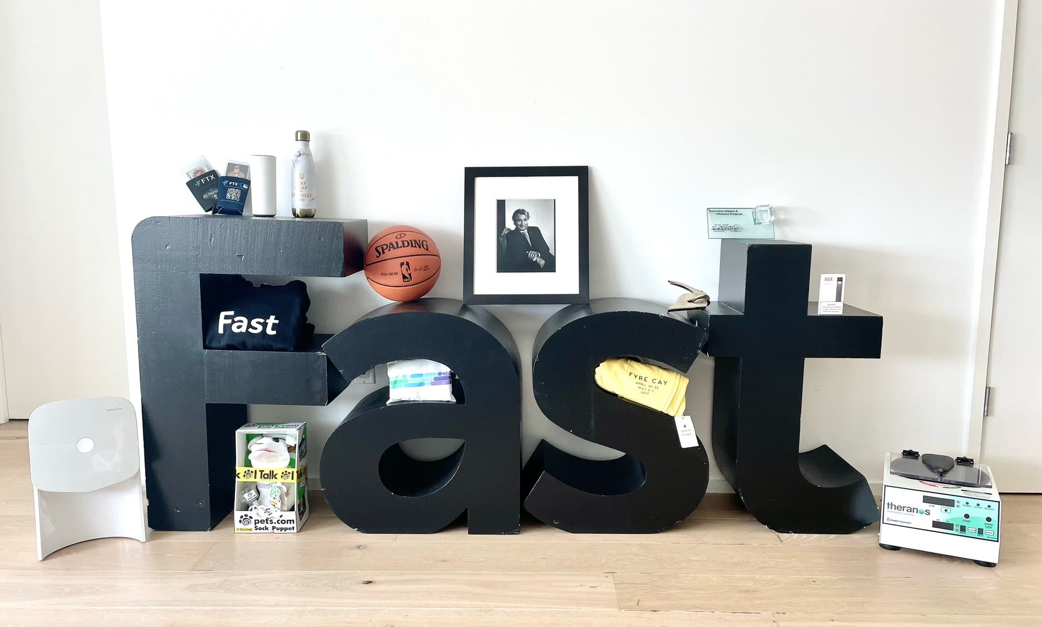 Several items in the Repository of Ill-Advised Ventures collection arranged around large FAST letters.